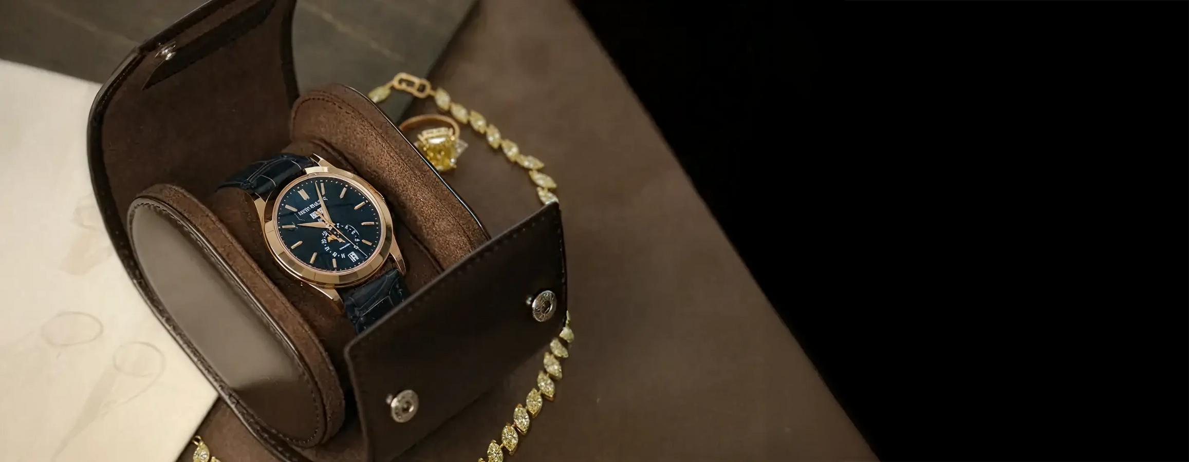 Luxury watch in leather case with yellow diamond jewelry
