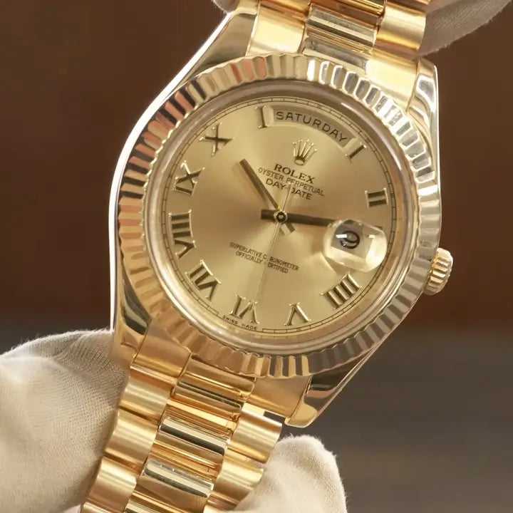 Gold Rolex Day-Date with champagne dial