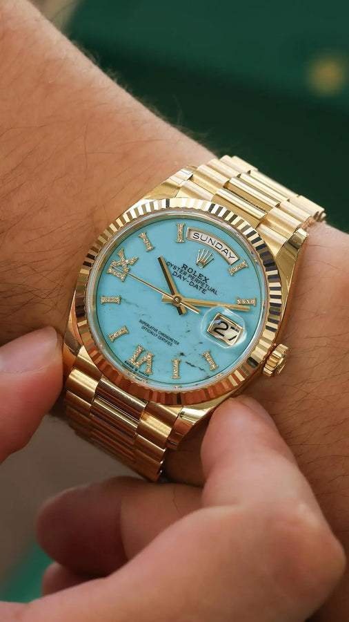 Gold Rolex Day-Date with turquoise dial